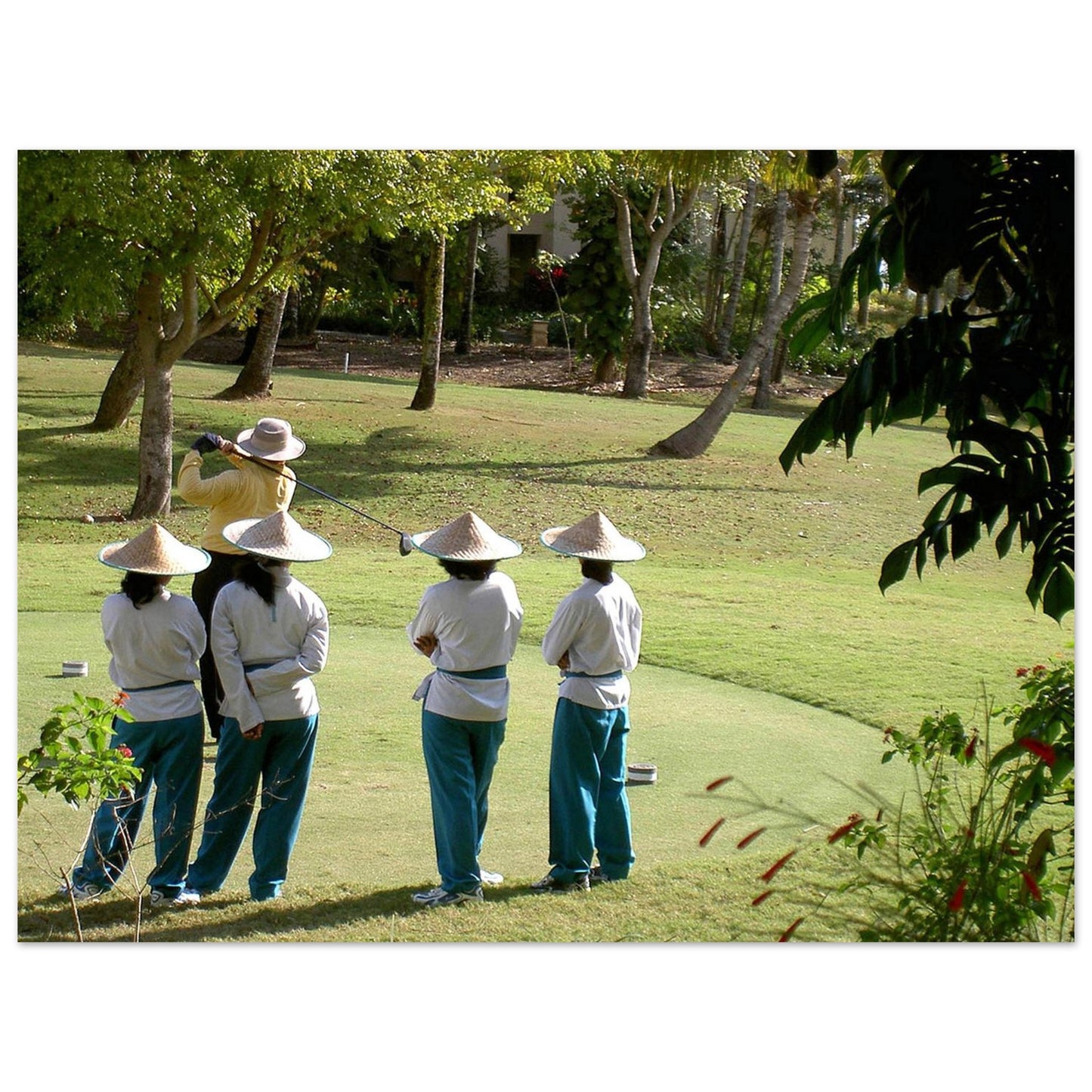 Indonésie-Bali : Photo le joueur de golf et ses caddies